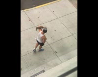 Man feed squirrel that climb on his shoulder