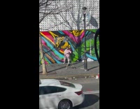 Woman in pink outfit spins her ponytail