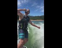 Guy white black automatic surfboard shotguns beer