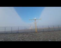 Large airplane cuts the clouds in a closeup