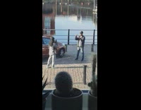 Guy black jacket cap car cactus dock