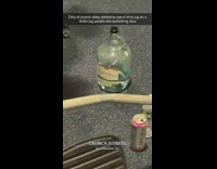 Large alcohol glass bottle being used as a water bottle at gym