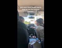 Woman teach her mom about backup camera