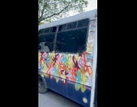 Collab winy - Parked van with flower graffiti on body