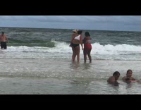 Girl guy hold hands run beach water