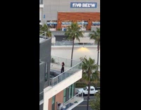 Woman tiktok dance on the building balcony