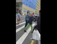 Grey car drives over curb 