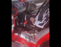 Guy connects computer mouse red car screen