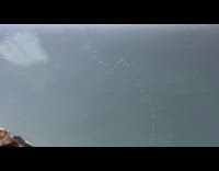 Small bubbles form line on aquarium rock