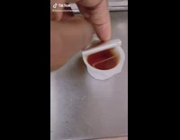 Guy dips fingers into maple syrup 
