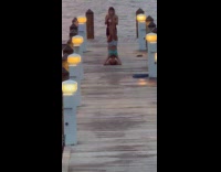 Woman in headstand pose for dock photo
