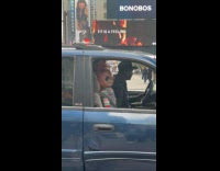 Collab WINY - Man drives car with chucky doll beside