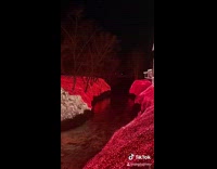 Two houses creek water christmas light set up