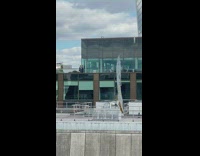 Men in suits do tiktok dance on terrace