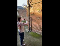 Man jump sideways head butt air wall