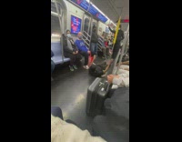 Guy breakdances in train aisle