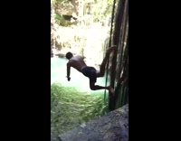 Guy dives into underwater cave, slips off rock and belly flops into water, slow motion