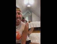 Couple duet lip sync while rolling around 