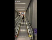 Woman falls on moving walkway 