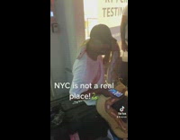 Man with large albino snake on shoulder