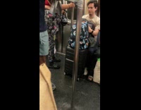 Collab Subway Creatures - Man doing exercise resistance bands while standing in subway