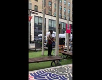 Guy sings WAP acoustic guitar black pants