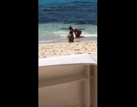 Kid photographs girl in pink bikini
