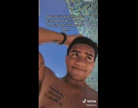 Shirtless guy with hand on his head 