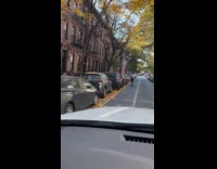 Couple with baby riding scooter 