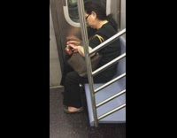 Lady clipping nails on subway