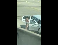Guy eats in his underwear by car