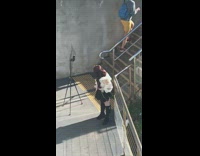 White shirt black skirt girl stairs tripod 