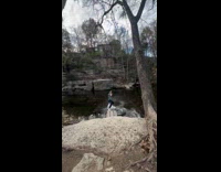 Man uses swing attached on the ground