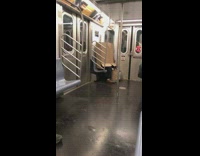 A person sitting with cardboard box on them