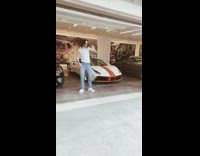 Guy tiktok dance garage expensive sports cars
