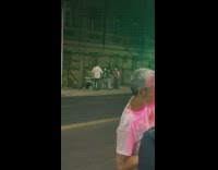 Guy drink champagne green pink LED street