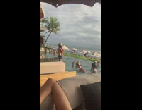 Woman slowly removes her skirt to show her bikini