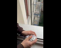 Guy shoot foil in trash bin hole 