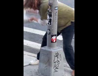 Man hits bottle in shoe on post