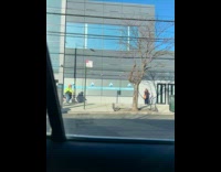 Man ride bike target bag hat sidewalk