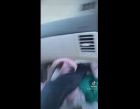Woman sarcastically showing off her friends really dirty car