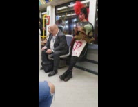 Girl wearing pig nose rides subway