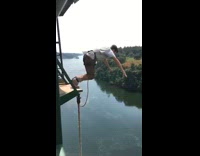 Guy bungee jumps river leap of faith 