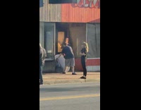 Woman photo shoot closed store man graffiti justice