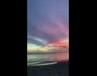 Beach sunset white vertical clouds colorful sky