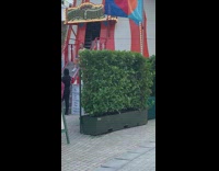 Woman orange outfit posed on Helter Skelter stairs