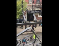 Live band marching through street playing music