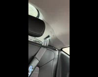 Liquid spills from the seatbelt hole inside the car