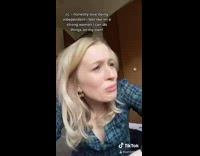 Girl cries while brushing snow off car 