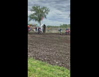 Biker drives over person in bmx race 